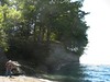 Allen > Allen is standing by a lovely cascade flowing into Lake Erie, where we camped on the edge of a high bluff. (KB)